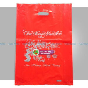 túi PE đỏ in chữ chúc mừng năm mới và cành đào